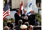 Anwar Sadat, Jimmy Carter and Menachem Begin shakes hands at the treaty signing at the White House on March 26, 1979.