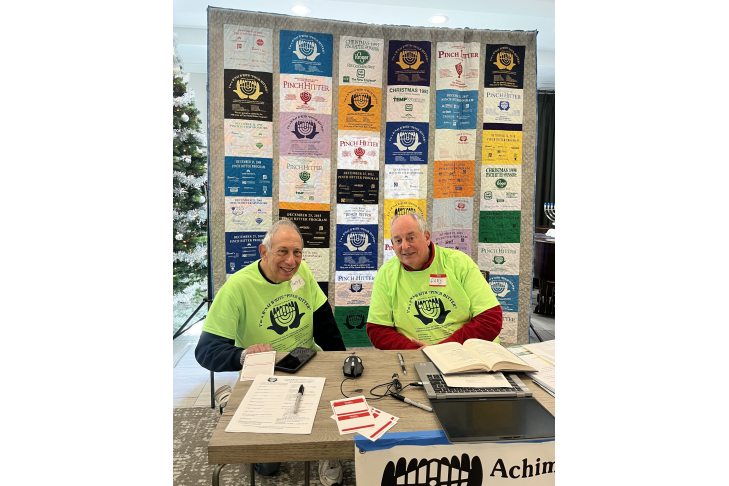 Harry Lutz and Gary Jackson with quilt