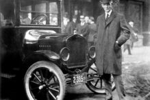 While other auto makers wanted to design luxury cars, Henry Ford designed a car that anyone could afford. Here he is standing by that very car. From the collections of The Henry Ford and Ford Motor Company.